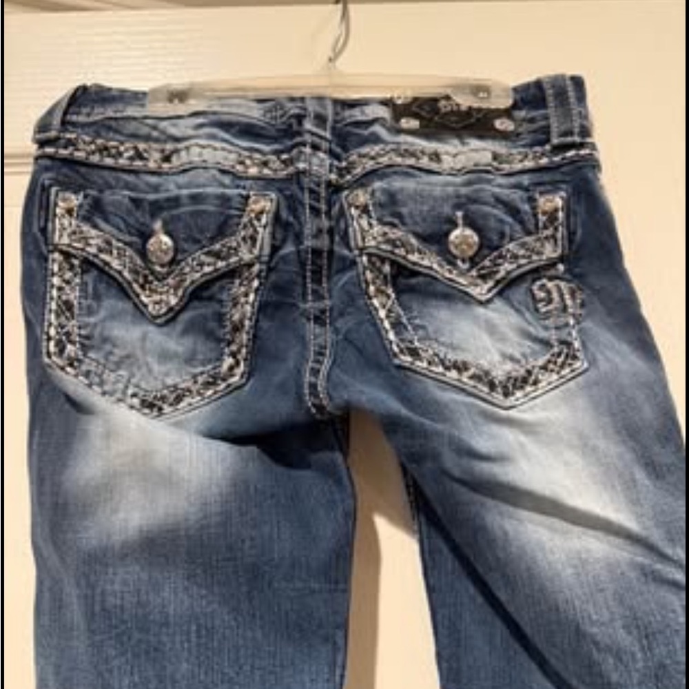Miss Me Distressed Denim, Straight Leg Jeans with Embellished Pockets.